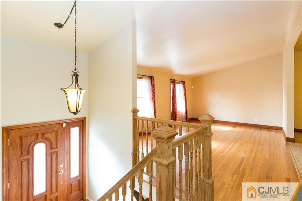 19 Bodnarik Road Edison, NJ 08837 - Photo 4 of 50 a view of an entryway with a mirror
