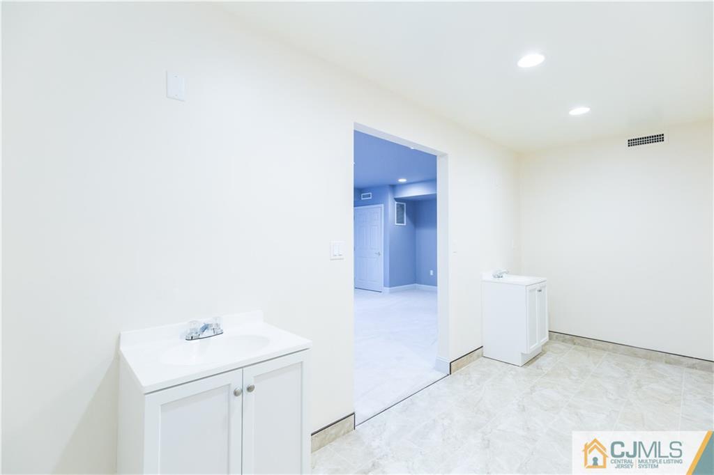 19 Bodnarik Road Edison, NJ 08837 - Photo 40 of 50 a bathroom with a sink and a toilet