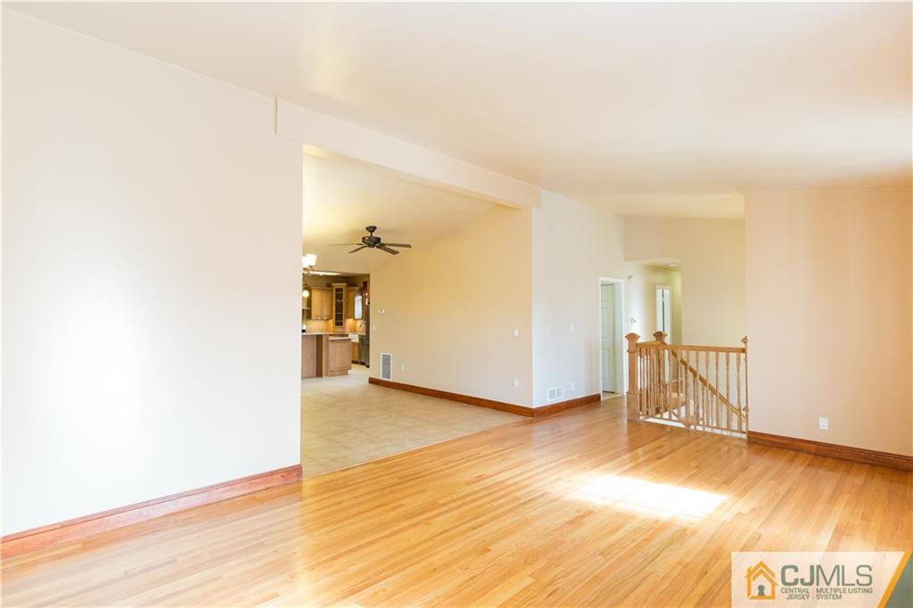19 Bodnarik Road Edison, NJ 08837 - Photo 6 of 50 a view of empty room with wooden floor