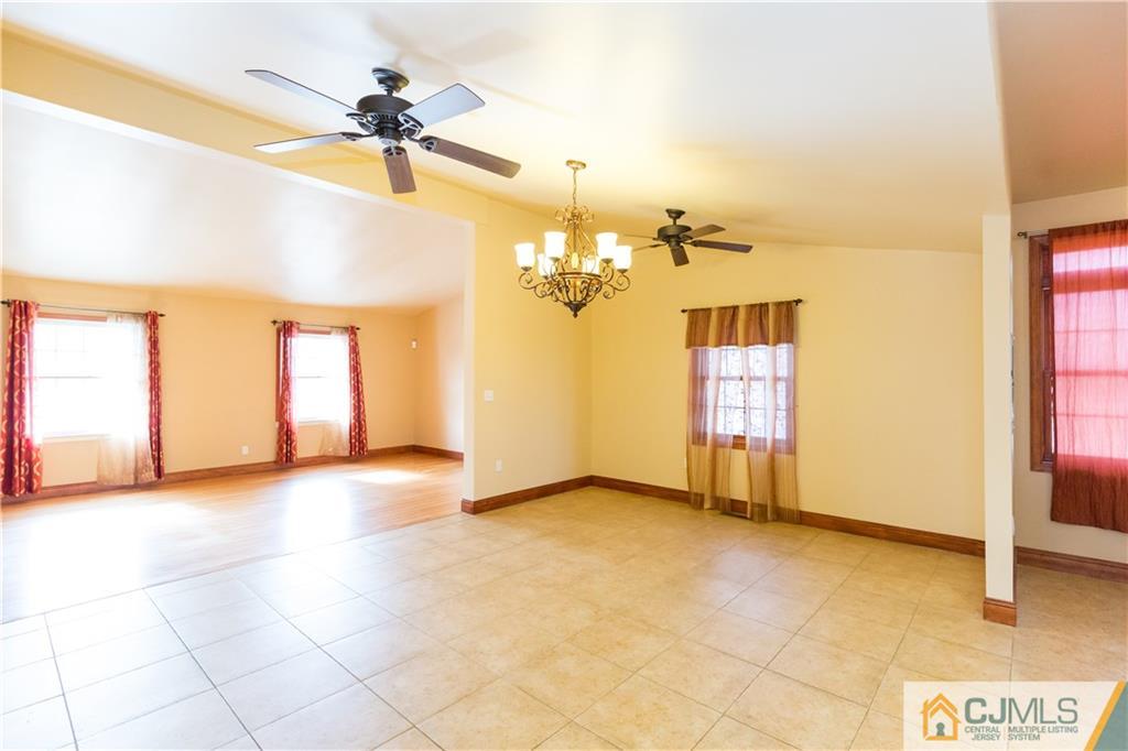19 Bodnarik Road Edison, NJ 08837 - Photo 9 of 50 a view of a livingroom with a chandelier fan and a window
