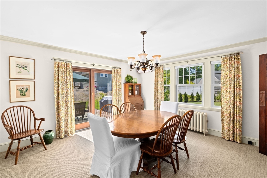 157 Branch Street Scituate, MA 02066 - Photo 11 of 41 a dining room with furniture a chandelier and wooden floor