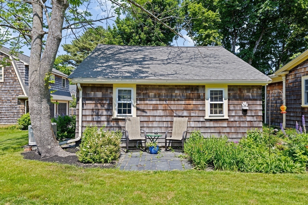 157 Branch Street Scituate, MA 02066 - Photo 29 of 41 a view of a house with a yard and sitting area