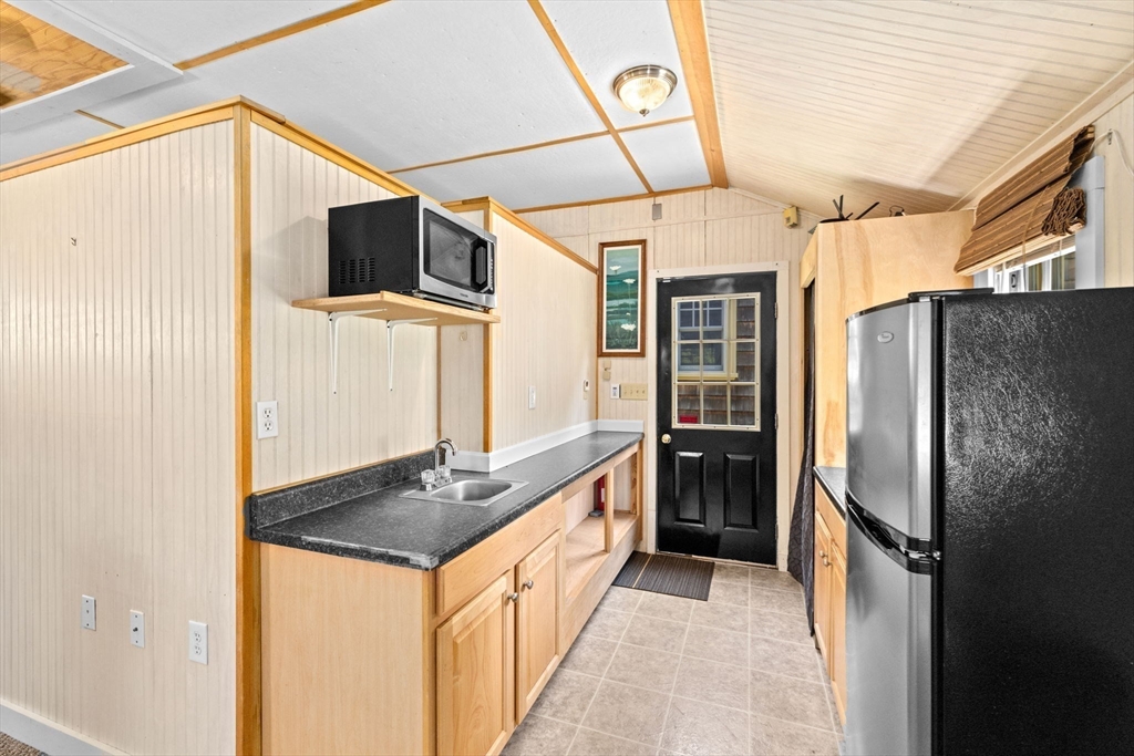 157 Branch Street Scituate, MA 02066 - Photo 30 of 41 a kitchen with stainless steel appliances a refrigerator and a stove