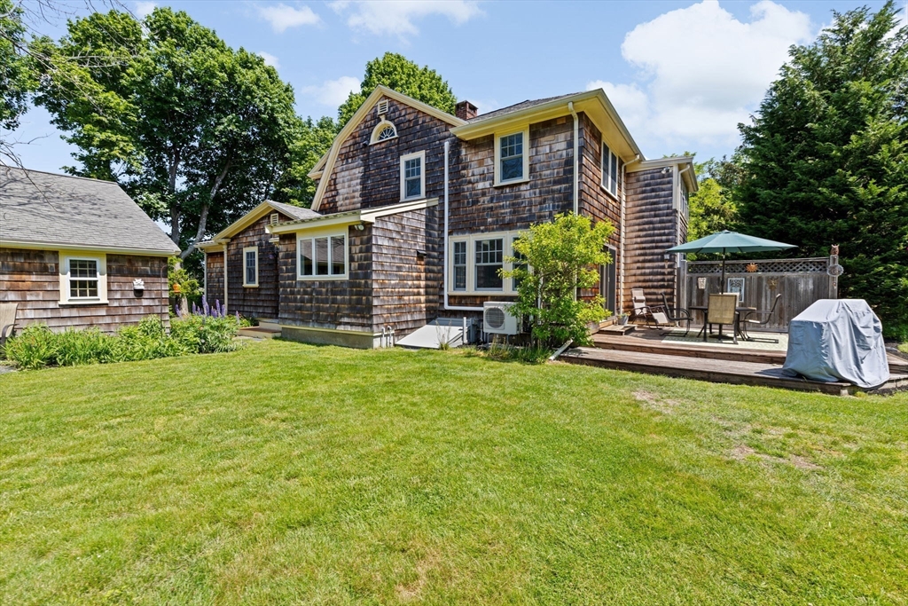 157 Branch Street Scituate, MA 02066 - Photo 36 of 41 a front view of a house with garden