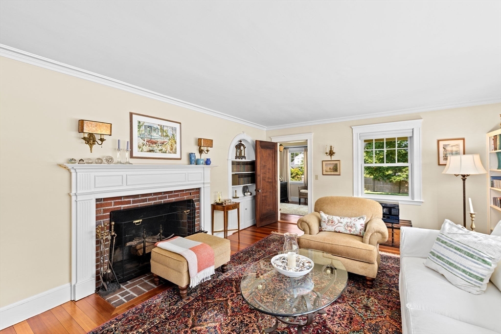 157 Branch Street Scituate, MA 02066 - Photo 6 of 41 a living room with furniture and a fireplace