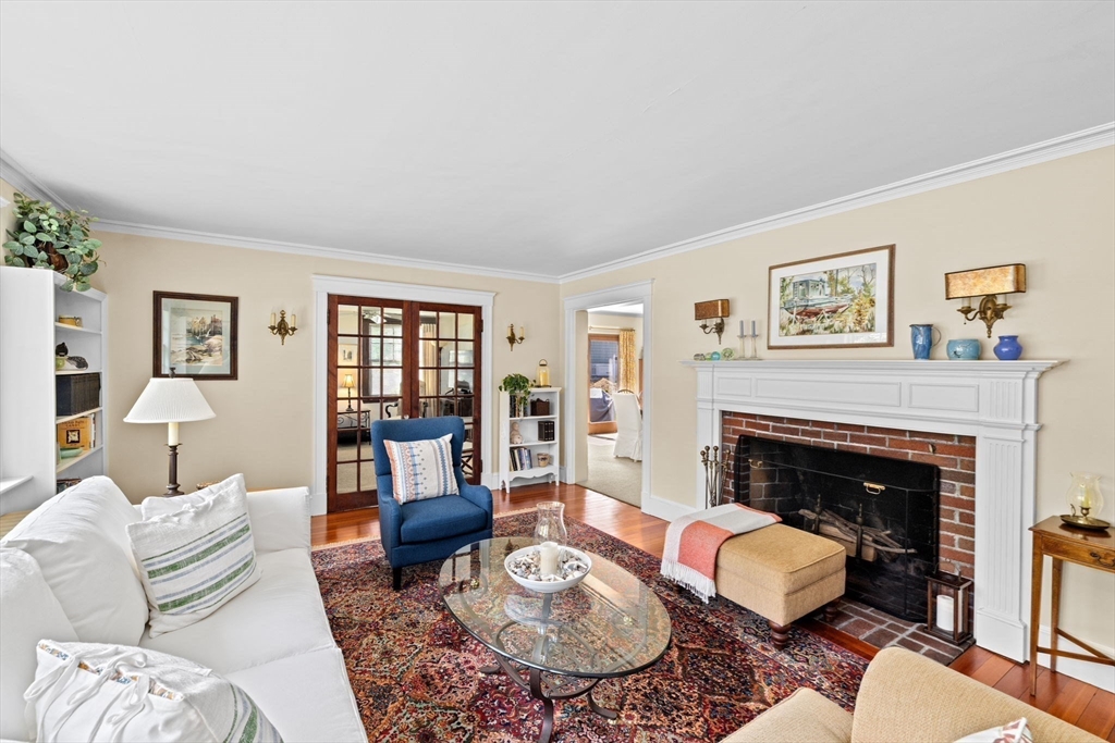 157 Branch Street Scituate, MA 02066 - Photo 7 of 41 a living room with furniture a rug and a fireplace
