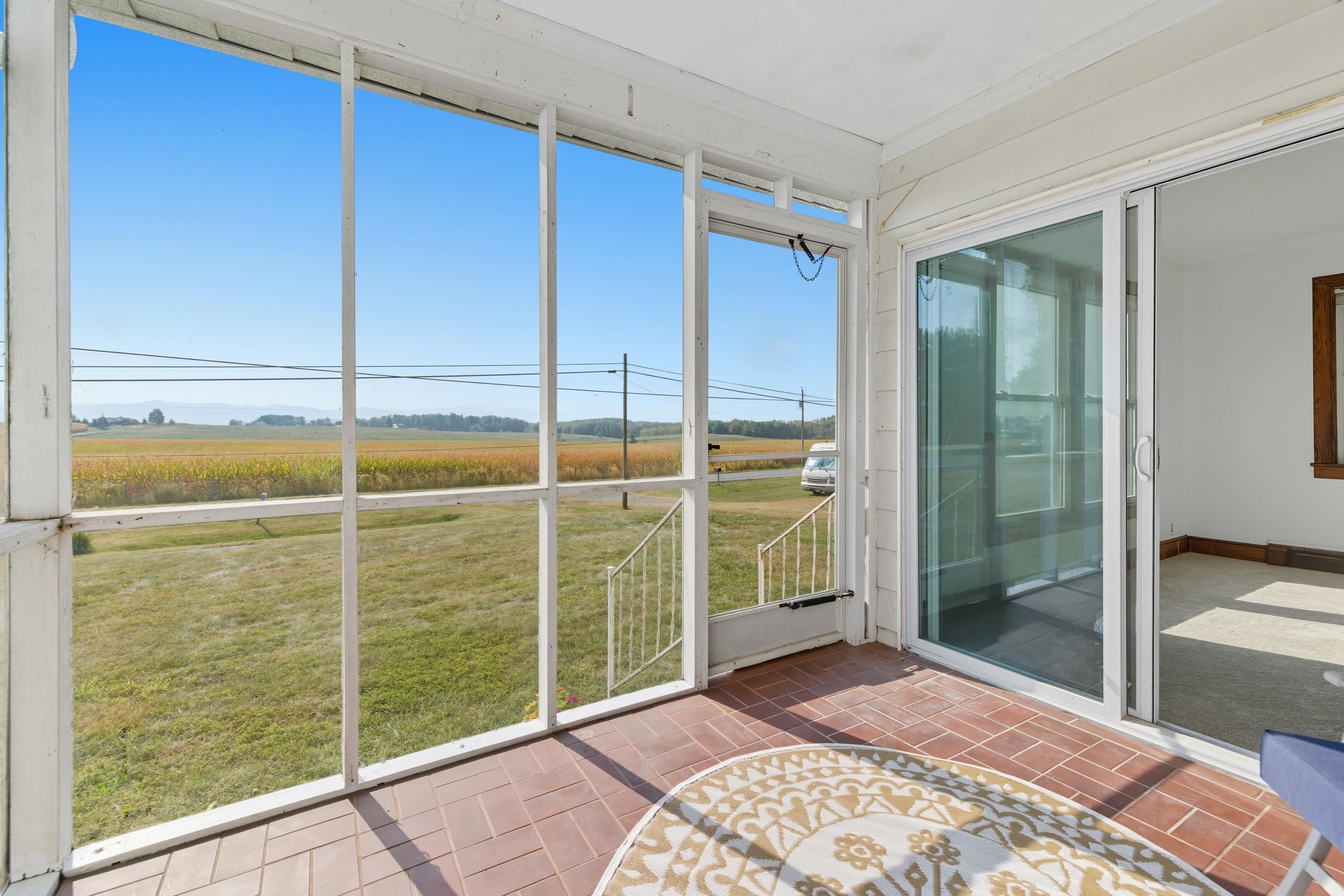 3138 Cross Keys Road Harrisonburg, VA 22801 - Photo 33 of 74 The large screened in porch features beautiful views of the nearby mountains and plenty of space for furniture and enjoying friends and family.