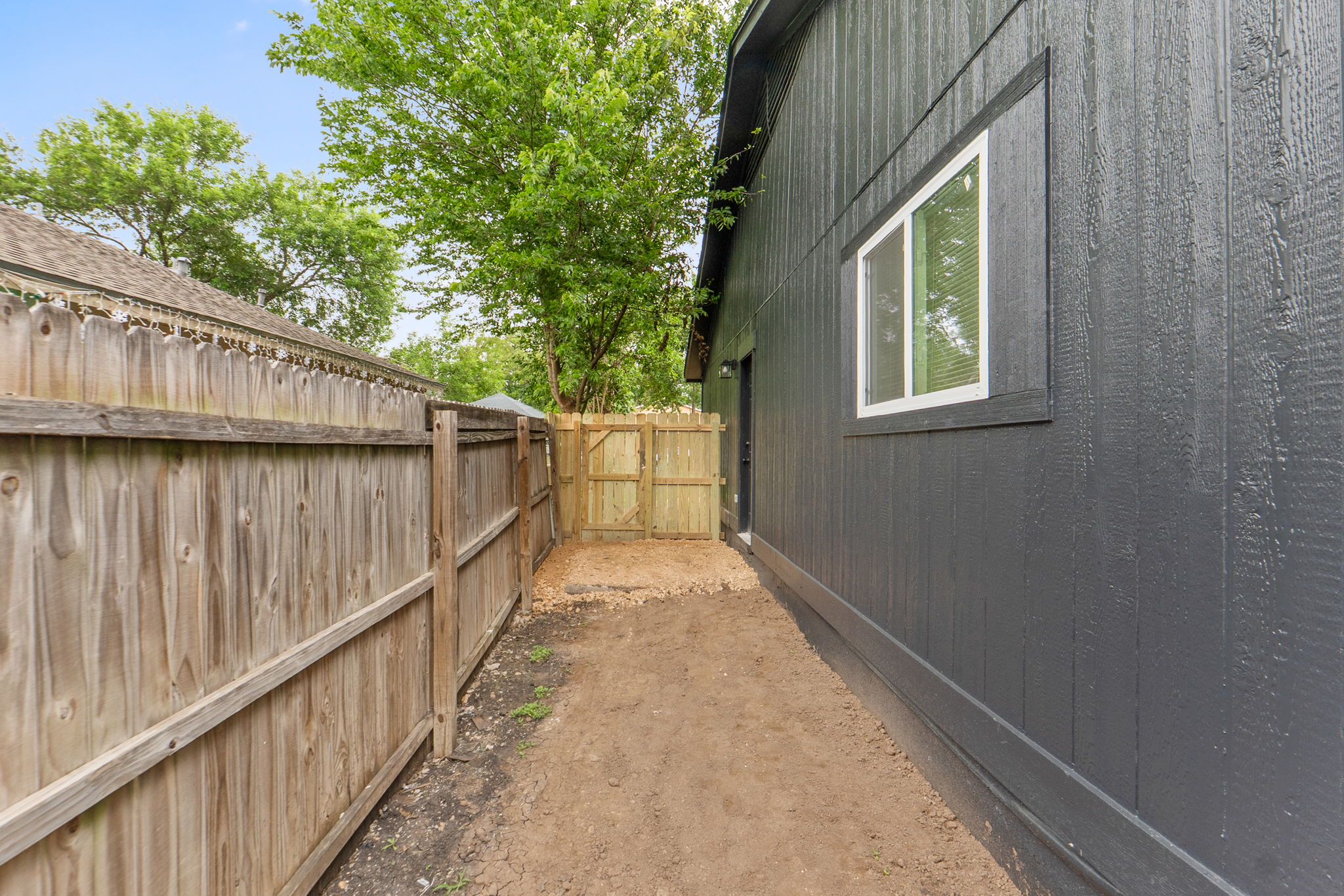 8203 Colony Loop Drive Austin, TX 78724 - Photo 38 of 38 A well-maintained side yard with a sturdy privacy fence