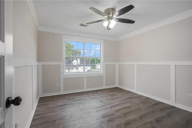 a view of a house with a yard and sitting space