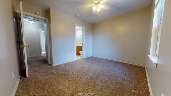 an empty room with closet area