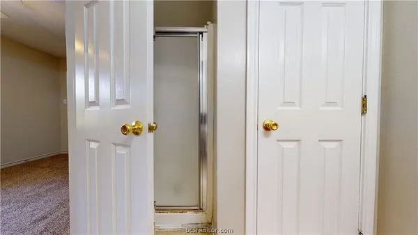 a bathroom with a sink a toilet and a window