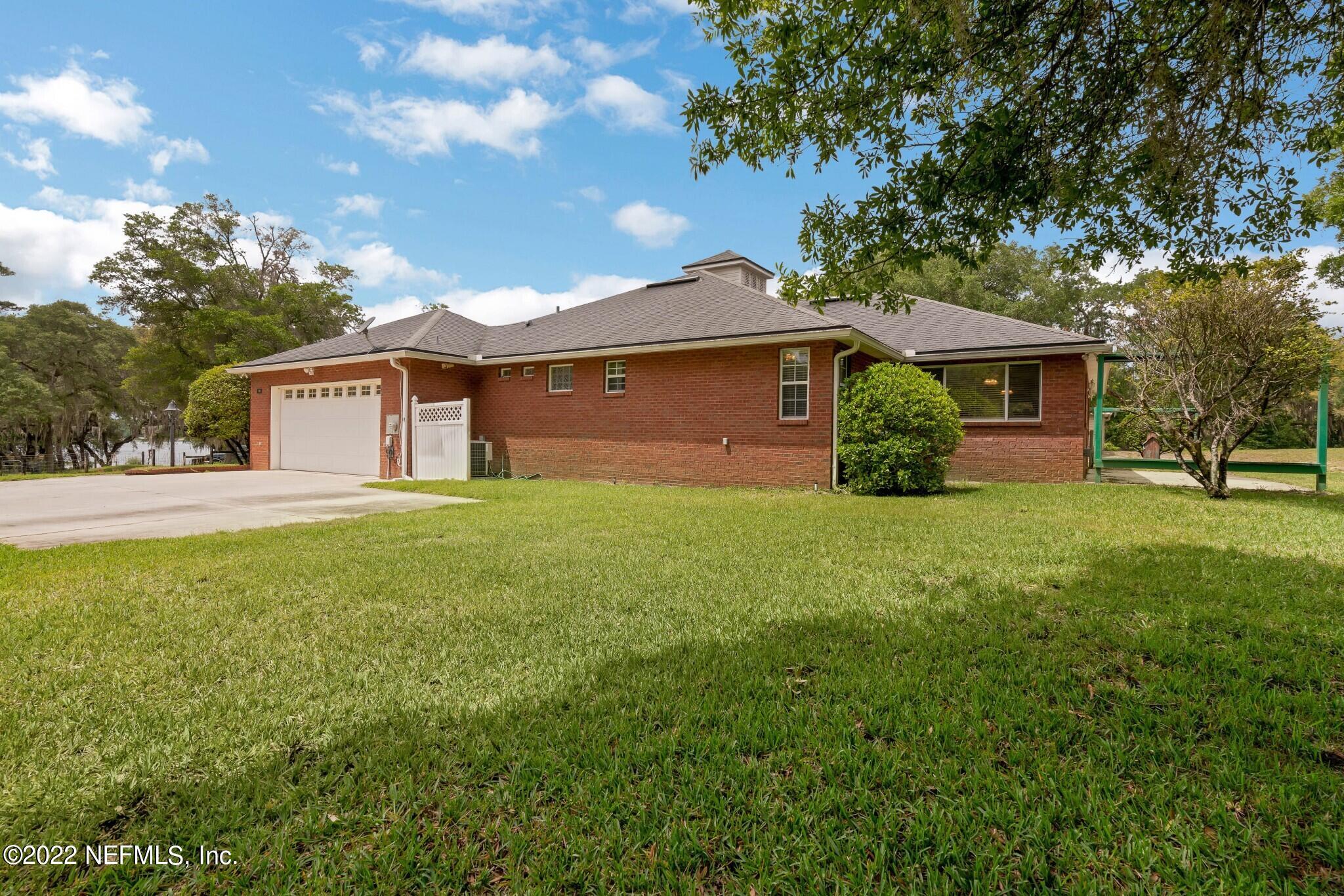 100 Bumpy Road Melrose, FL 32666 - Photo 4 of 31 EXTERIOR WITH GARAGE