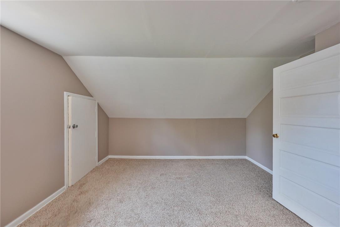 3050 Cornwall Road Bethlehem, PA 18017 - Photo 36 of 80 A cozy, sun-filled room offers sloped ceilings and plush carpet, perfect for a private retreat.
