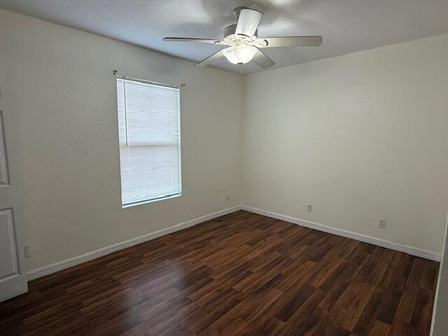 18066 Limestone Creek Road Limestone Creek, FL 33458 - Photo 12 of 25 wooden floor in an empty room with a window