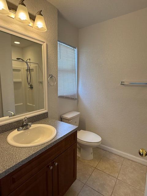 18066 Limestone Creek Road Limestone Creek, FL 33458 - Photo 13 of 25 a bathroom with a sink a toilet a mirror and vanity