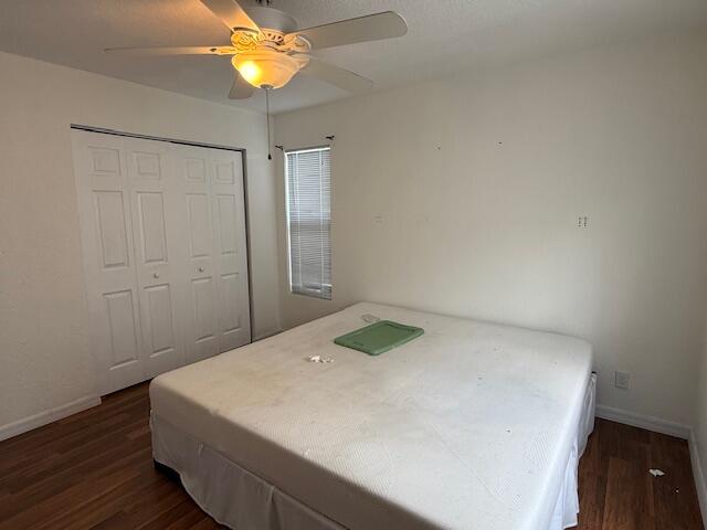 18066 Limestone Creek Road Limestone Creek, FL 33458 - Photo 15 of 25 a bedroom with a bed and a chandelier