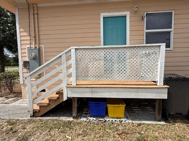 18066 Limestone Creek Road Limestone Creek, FL 33458 - Photo 22 of 25 a front view of a house with wooden stairs