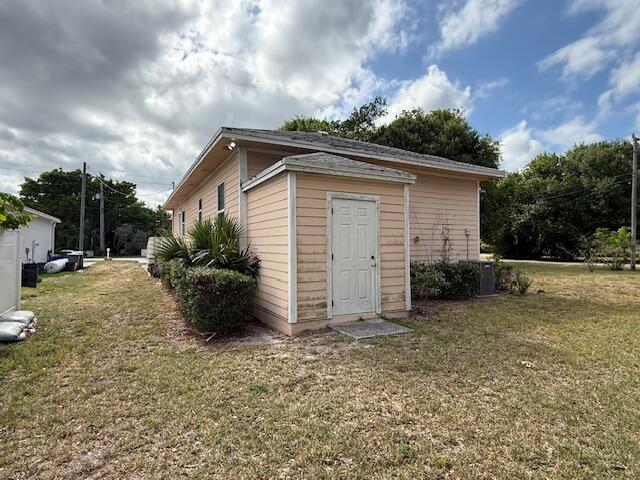 18066 Limestone Creek Road Limestone Creek, FL 33458 - Photo 23 of 25 a view of backyard of house and car parked