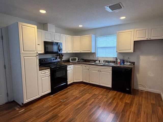 18066 Limestone Creek Road Limestone Creek, FL 33458 - Photo 7 of 25 a kitchen with a white cabinets a sink a window and stainless steel appliances