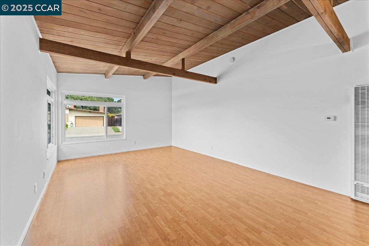 1655 Marlesta Road Pinole, CA 94564 - Photo 6 of 51 a view of empty room with wooden floor and fan
