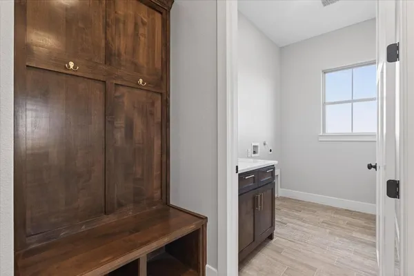a bathroom with a double vanity sink mirror and shower