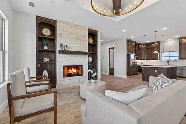 a living room with furniture and a fireplace