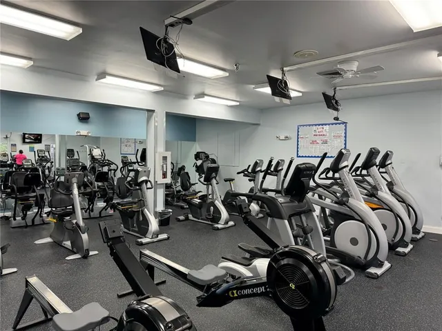 a front view of multi story commercial building with sign board