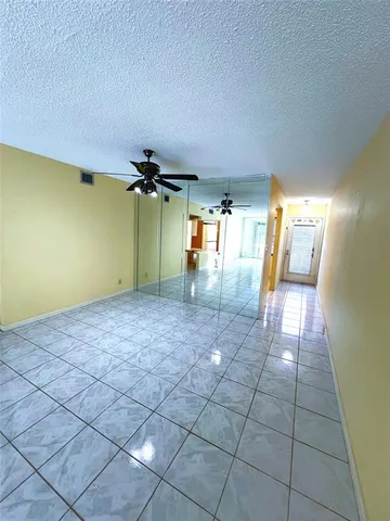 a kitchen that has a sink and a refrigerator
