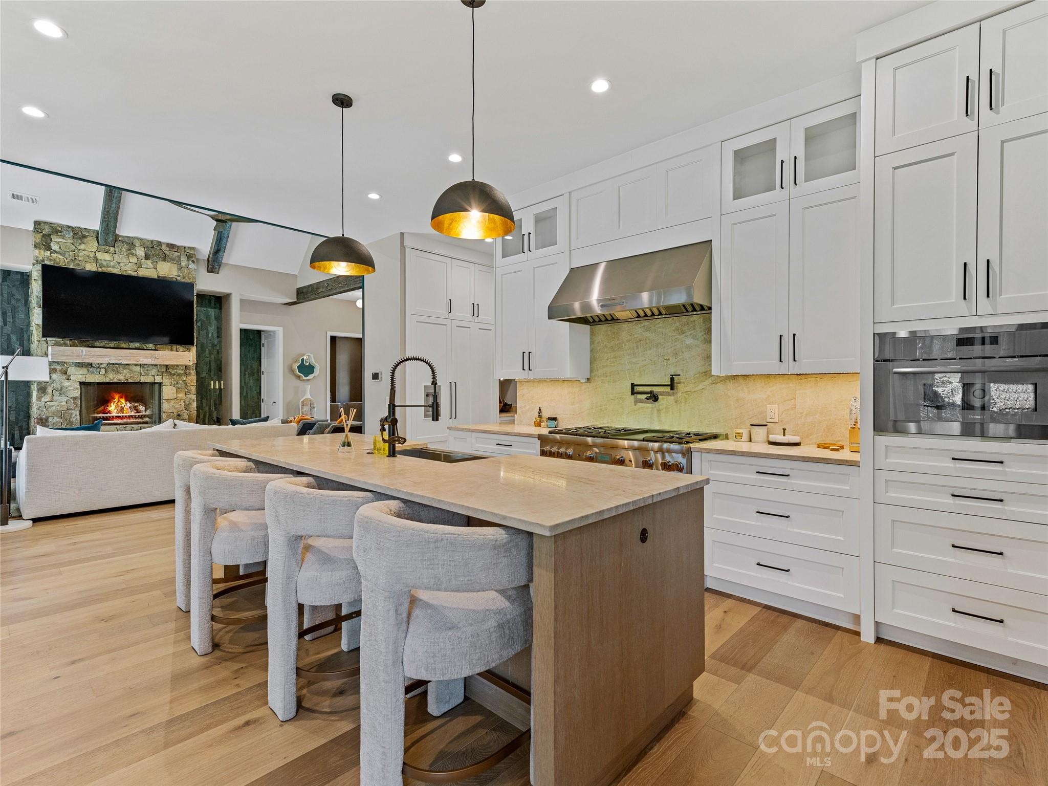 374 Turkey Roost Road Sapphire, NC 28774 - Photo 13 of 39 a kitchen with a sink stove and wooden floor