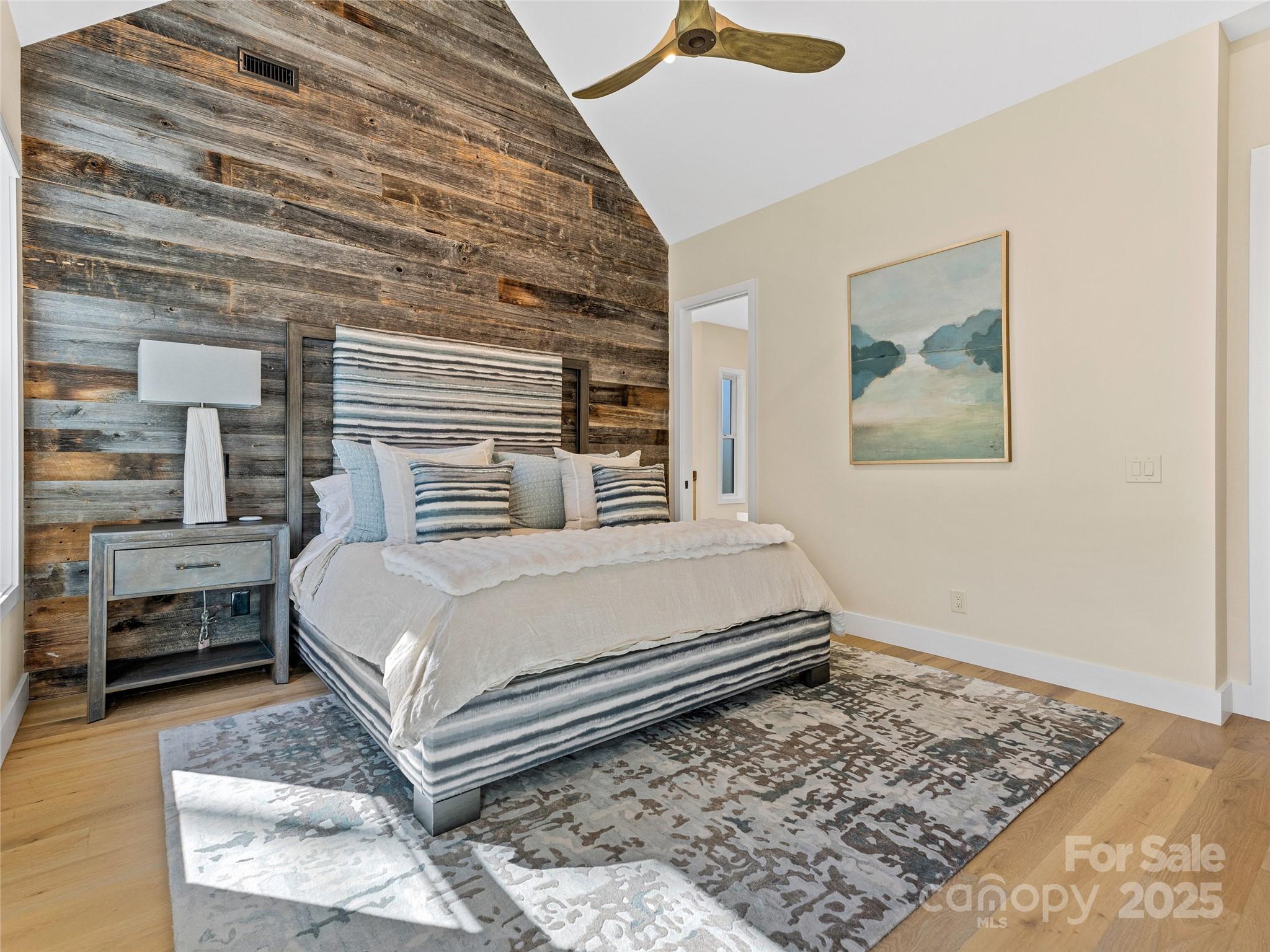 374 Turkey Roost Road Sapphire, NC 28774 - Photo 17 of 39 a bedroom with a bed and balcony view