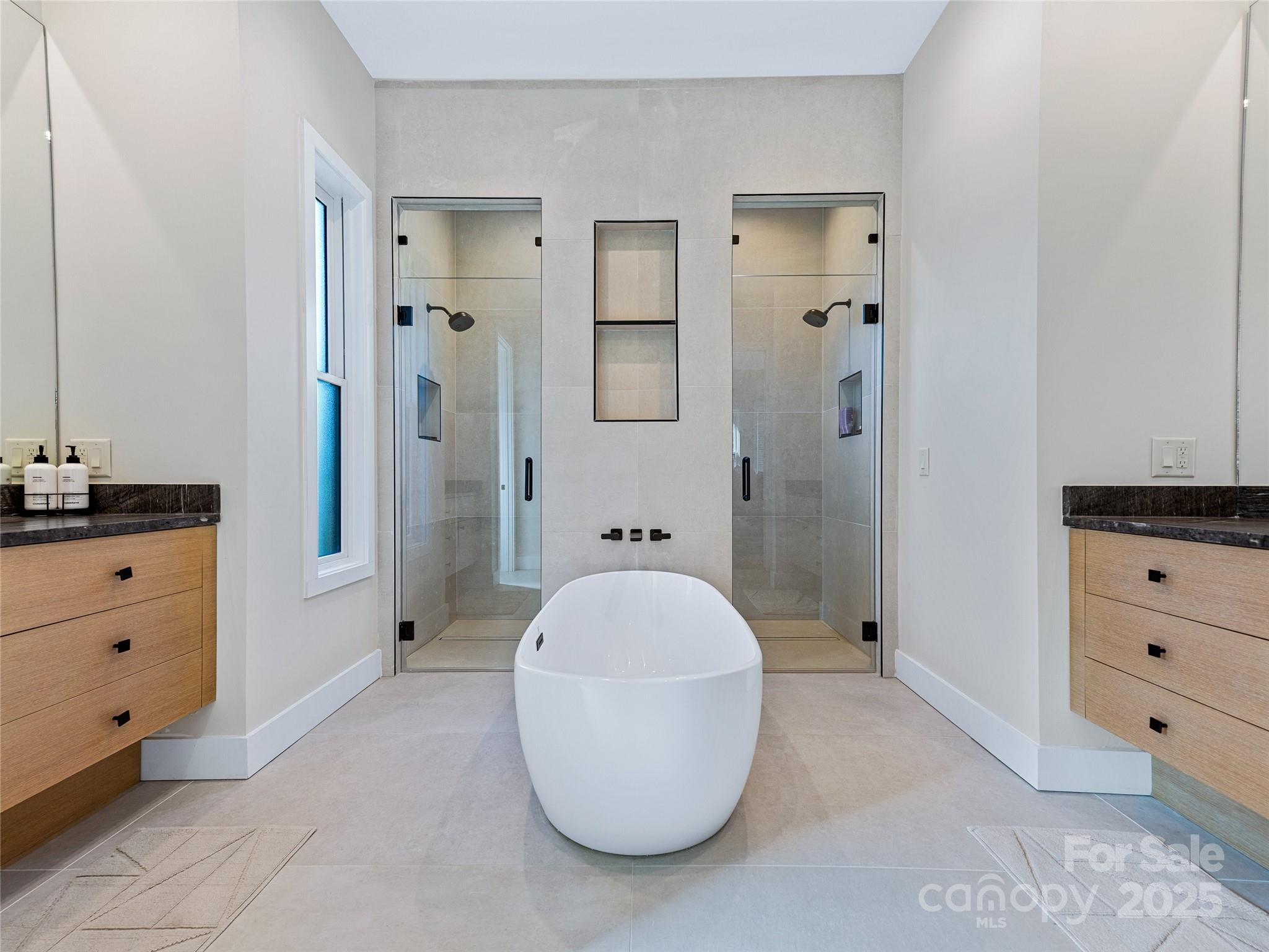 374 Turkey Roost Road Sapphire, NC 28774 - Photo 18 of 39 a bathroom with a sink a mirror and a shower