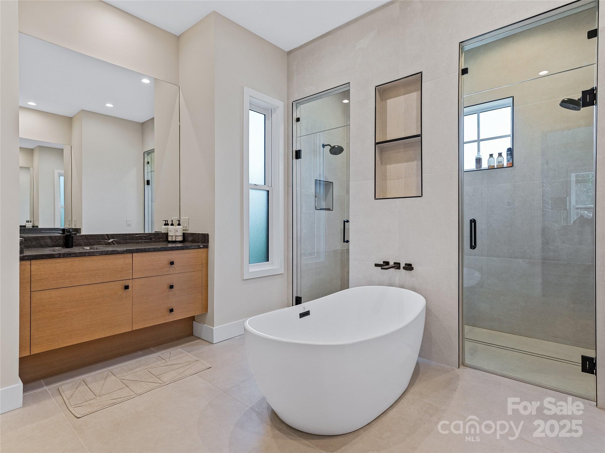 374 Turkey Roost Road Sapphire, NC 28774 - Photo 20 of 39 a bathroom with a tub sink and mirror