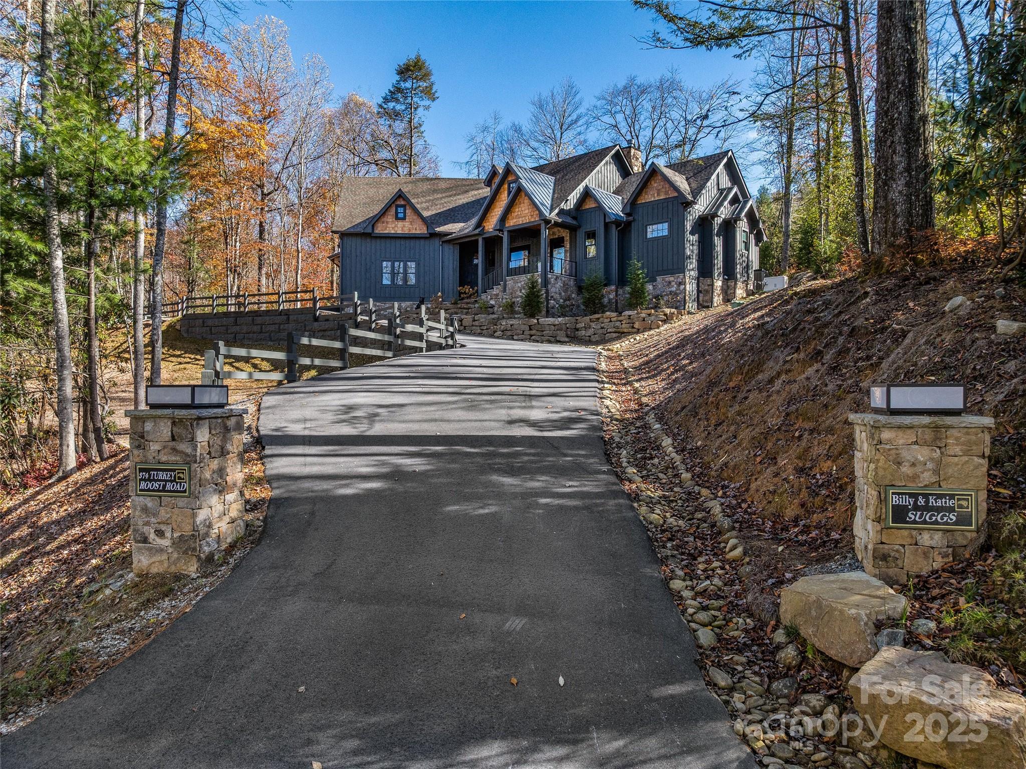 374 Turkey Roost Road Sapphire, NC 28774 - Photo 3 of 39 a front view of a house with a yard