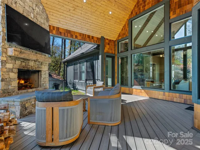 a view of a house with pool fire pit and outdoor seating