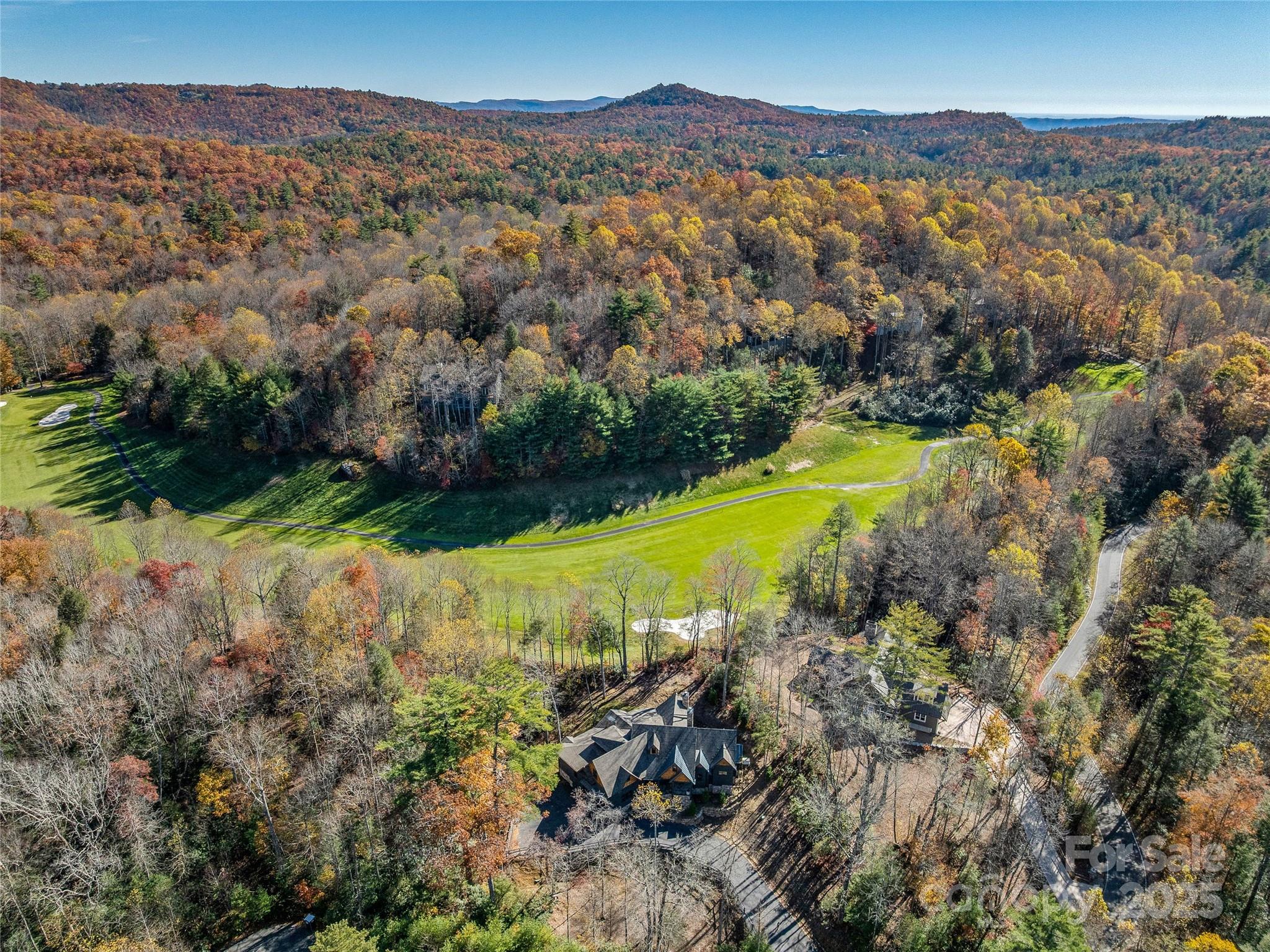 374 Turkey Roost Road Sapphire, NC 28774 - Photo 37 of 39 a view of a city with mountains in the background