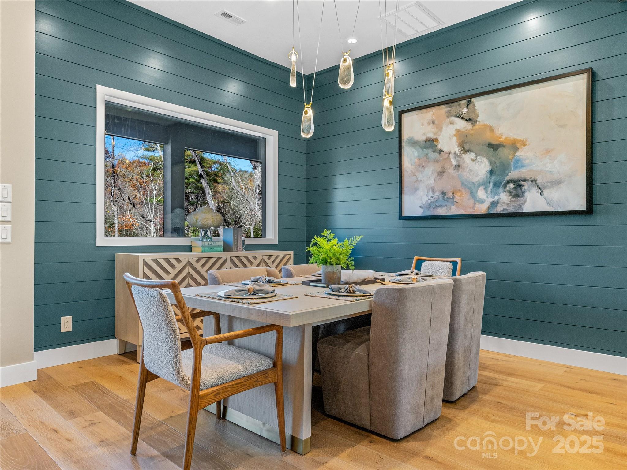 374 Turkey Roost Road Sapphire, NC 28774 - Photo 5 of 39 a view of a dining room with furniture large window and wooden floor