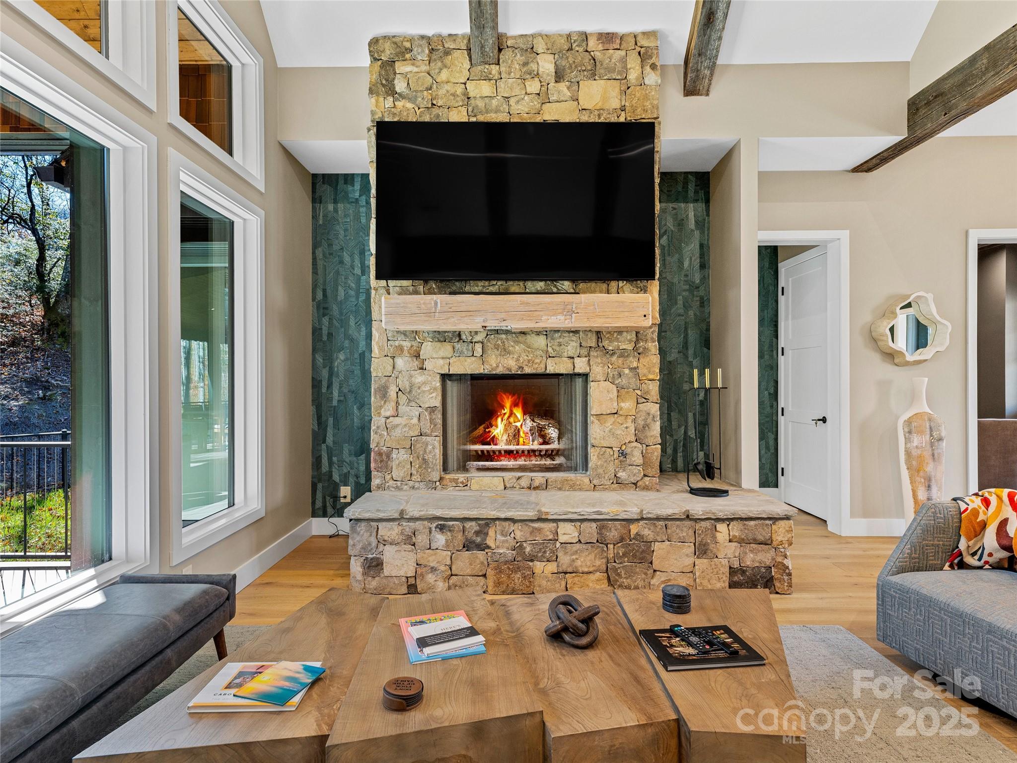 374 Turkey Roost Road Sapphire, NC 28774 - Photo 7 of 39 a living room with furniture and a fireplace