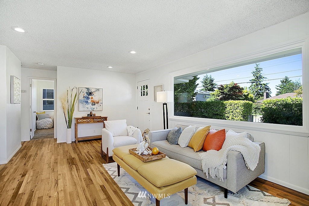 9226 13th Avenue Southwest Seattle, WA 98106 - Photo 3 of 13 a living room with furniture and a large window