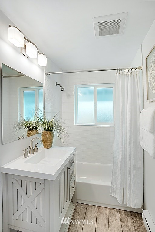 9226 13th Avenue Southwest Seattle, WA 98106 - Photo 7 of 13 a bathroom with a sink and a mirror