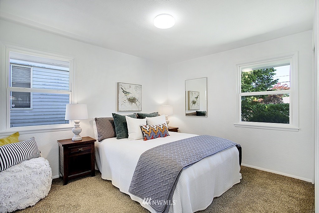 9226 13th Avenue Southwest Seattle, WA 98106 - Photo 8 of 13 a bedroom with a bed and a couch