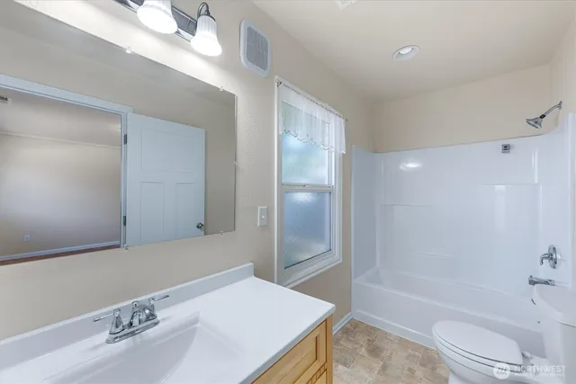 a bathroom with a bathtub and a sink