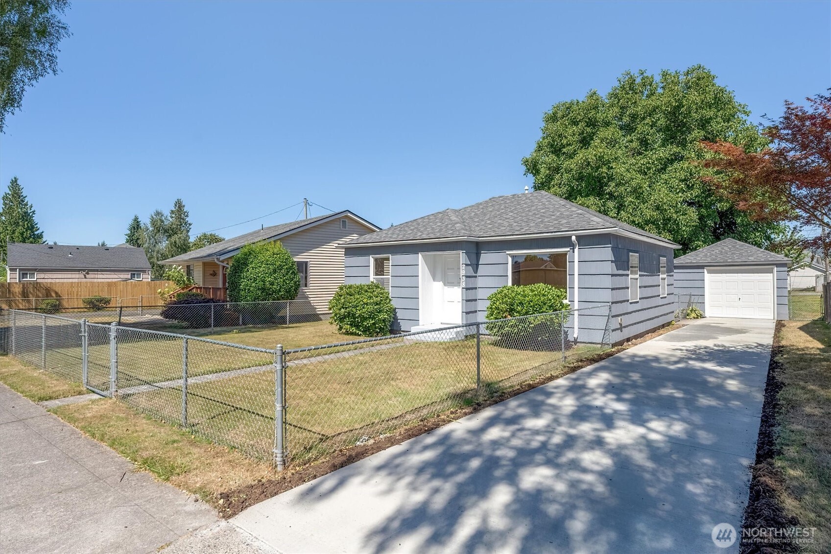 2938 Washington Way Longview, WA 98632 - Photo 2 of 21 a view of a house with backyard and a tree