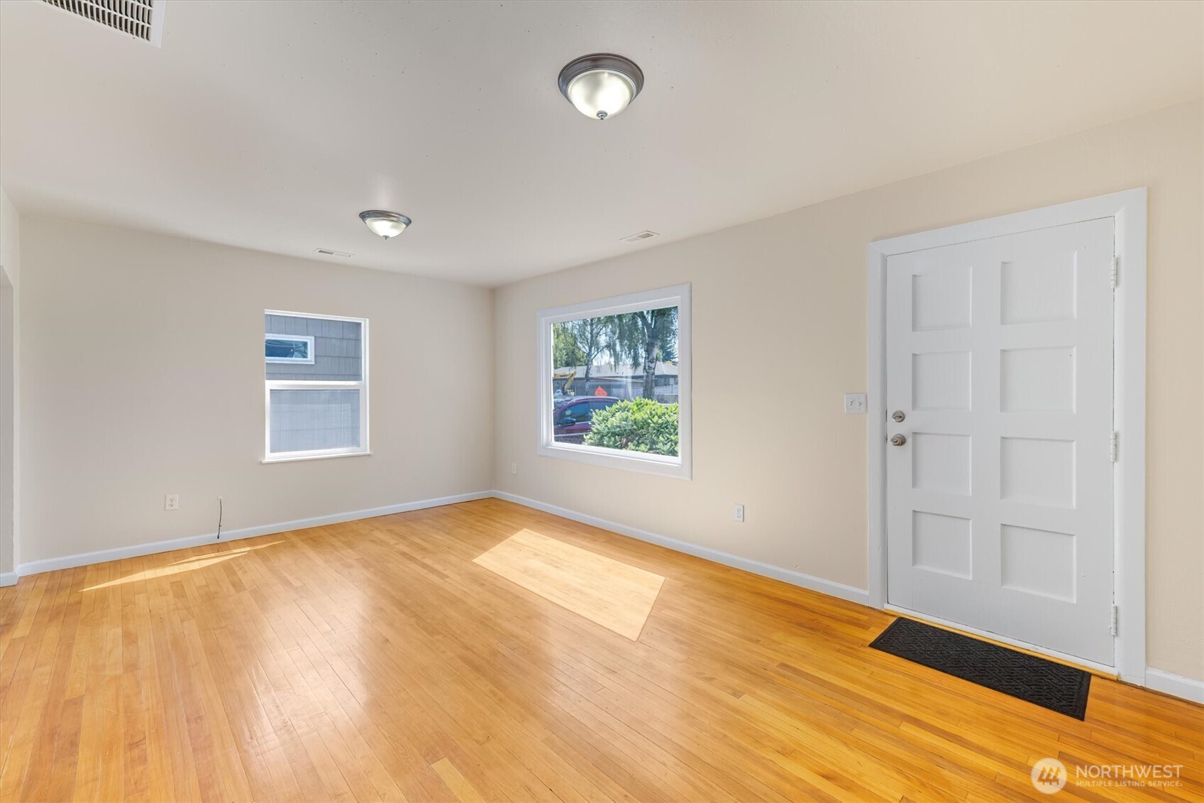 2938 Washington Way Longview, WA 98632 - Photo 4 of 21 a view of an empty room with window and wooden floor