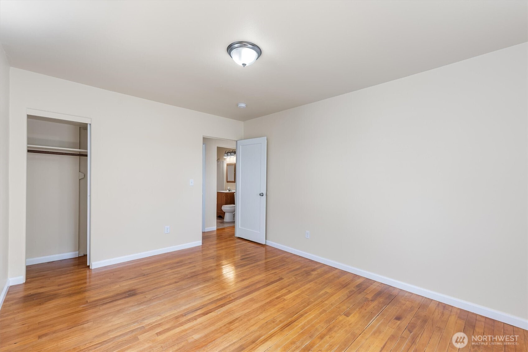 2938 Washington Way Longview, WA 98632 - Photo 6 of 21 a view of an empty room with wooden floor and a window