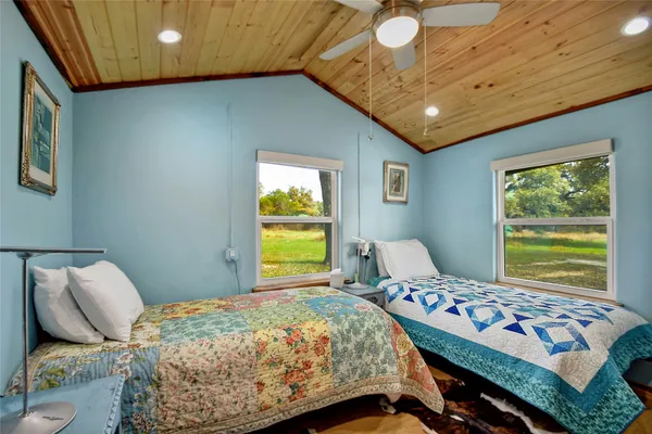 a bedroom with a bed and window