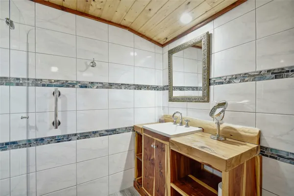 a utility room with sink dryer and washer