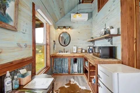 a view of a hallway with washer and dryer