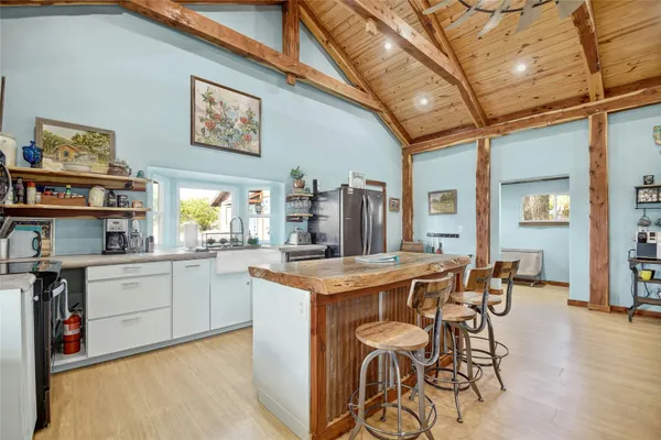 a view of a kitchen and dining room