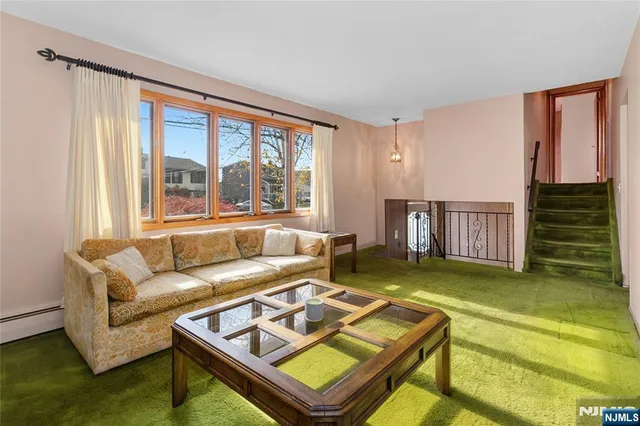 a kitchen with cabinets stainless steel appliances and a window