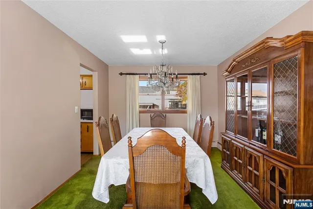 a view of kitchen with furniture and wooden floor